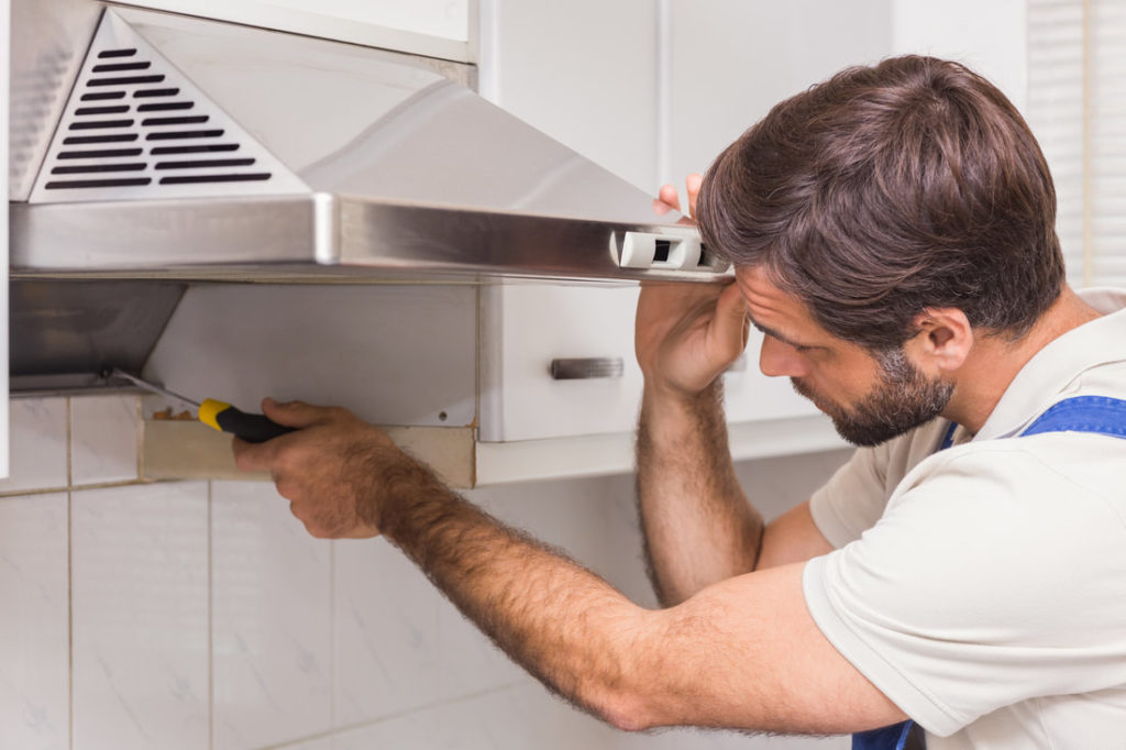 Delaware County Repair Man Fixing And Installing A Vent For An Oven In Delco
