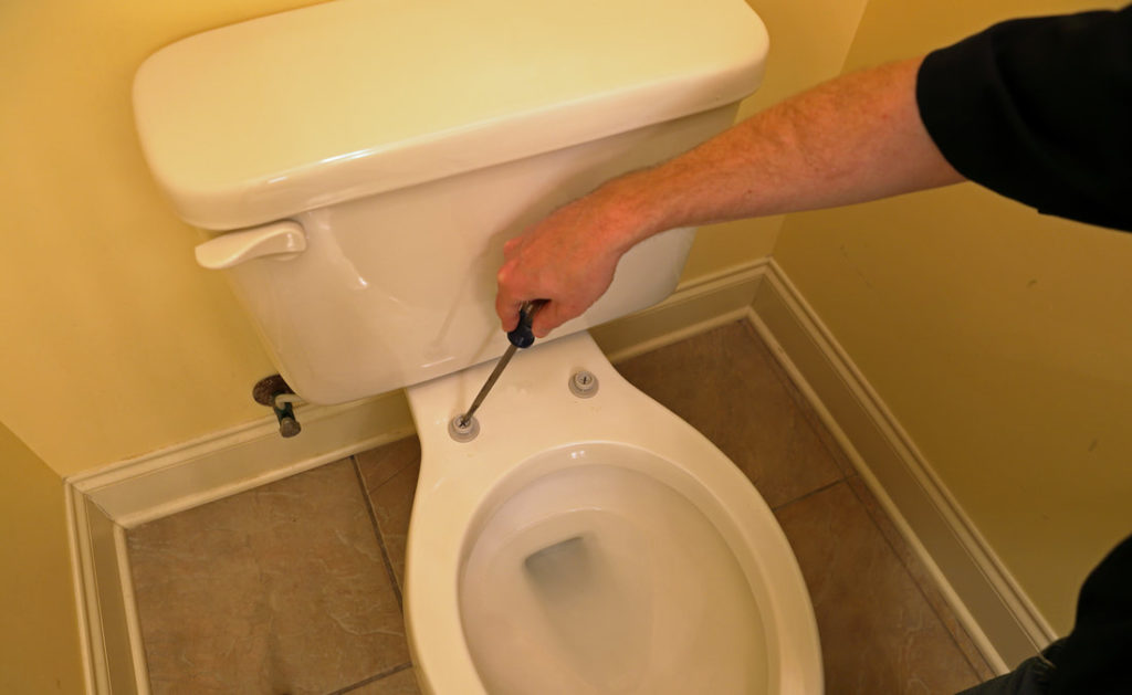 Delaware County Handyman Fixing A Toilet
